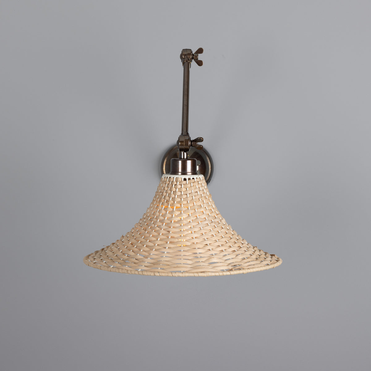Savannah Adjustable Arm Wall Light in Antique Brass with Large Bell Shaped Rattan Shade