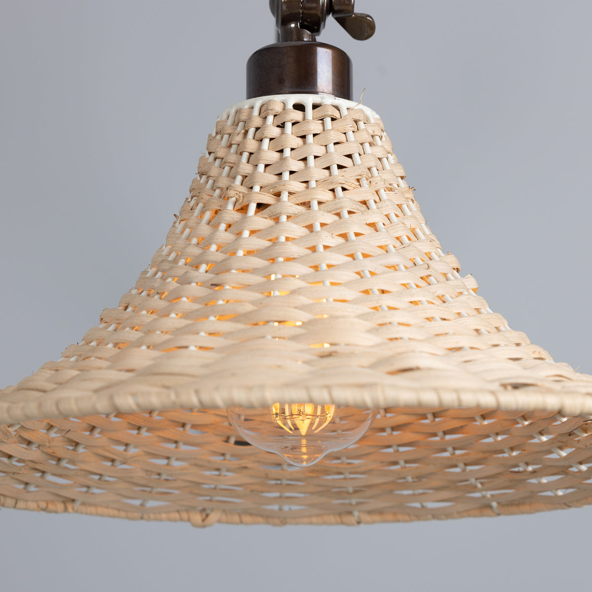Savannah Adjustable Arm Wall Light in Antique Brass with Large Bell Shaped Rattan Shade