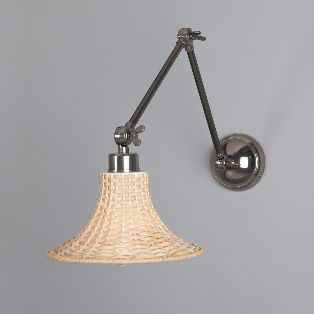 Savannah Adjustable Arm Wall Light in Antique Silver with Small Bell Shaped Rattan Shade