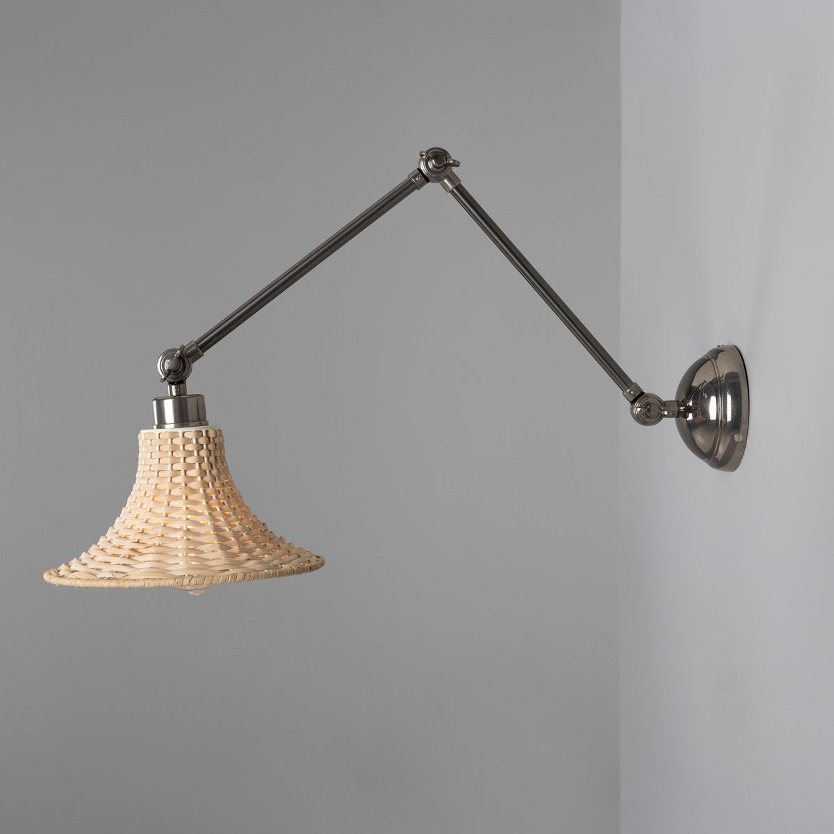 Savannah Adjustable Arm Wall Light in Antique Silver with Small Bell Shaped Rattan Shade