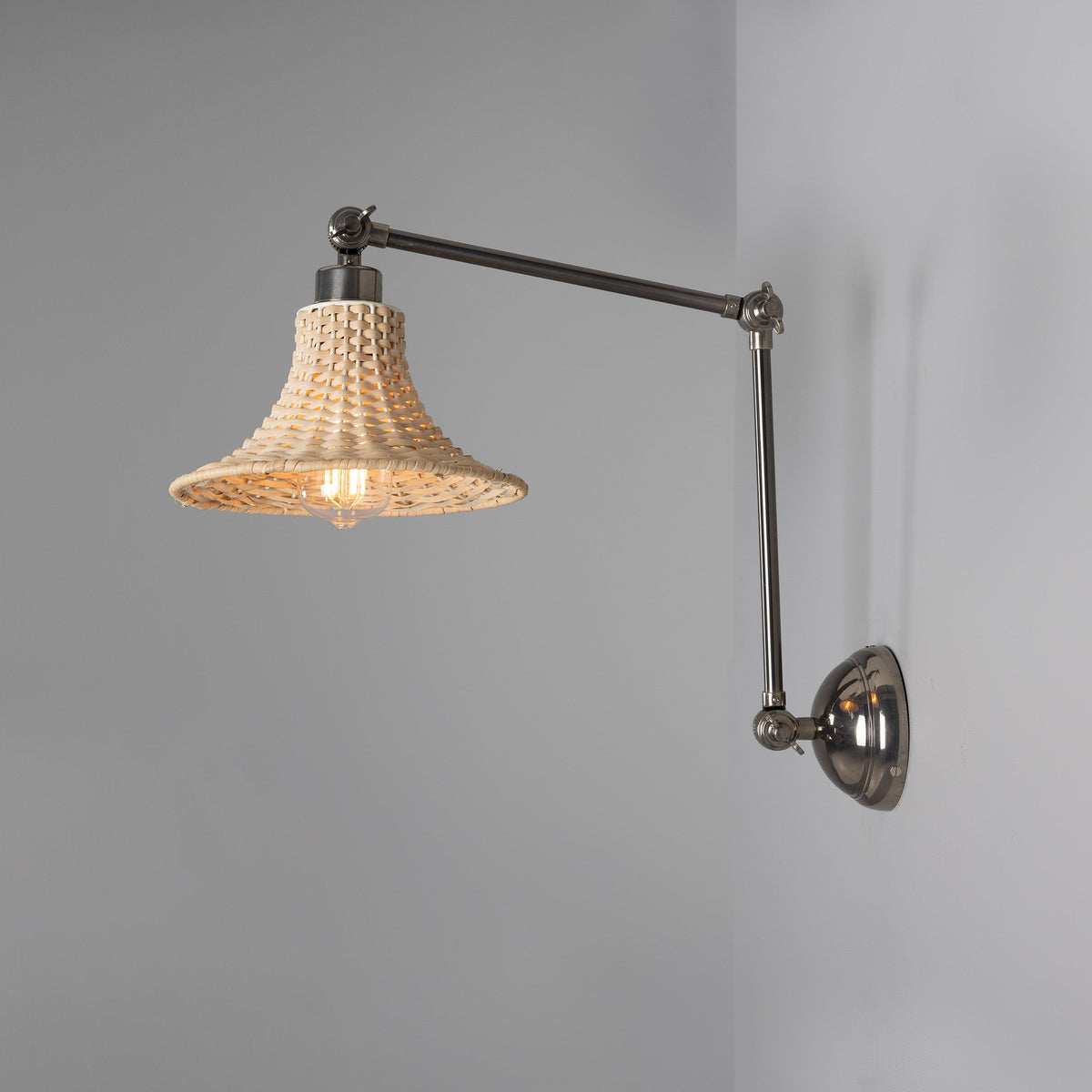Savannah Adjustable Arm Wall Light in Antique Silver with Small Bell Shaped Rattan Shade
