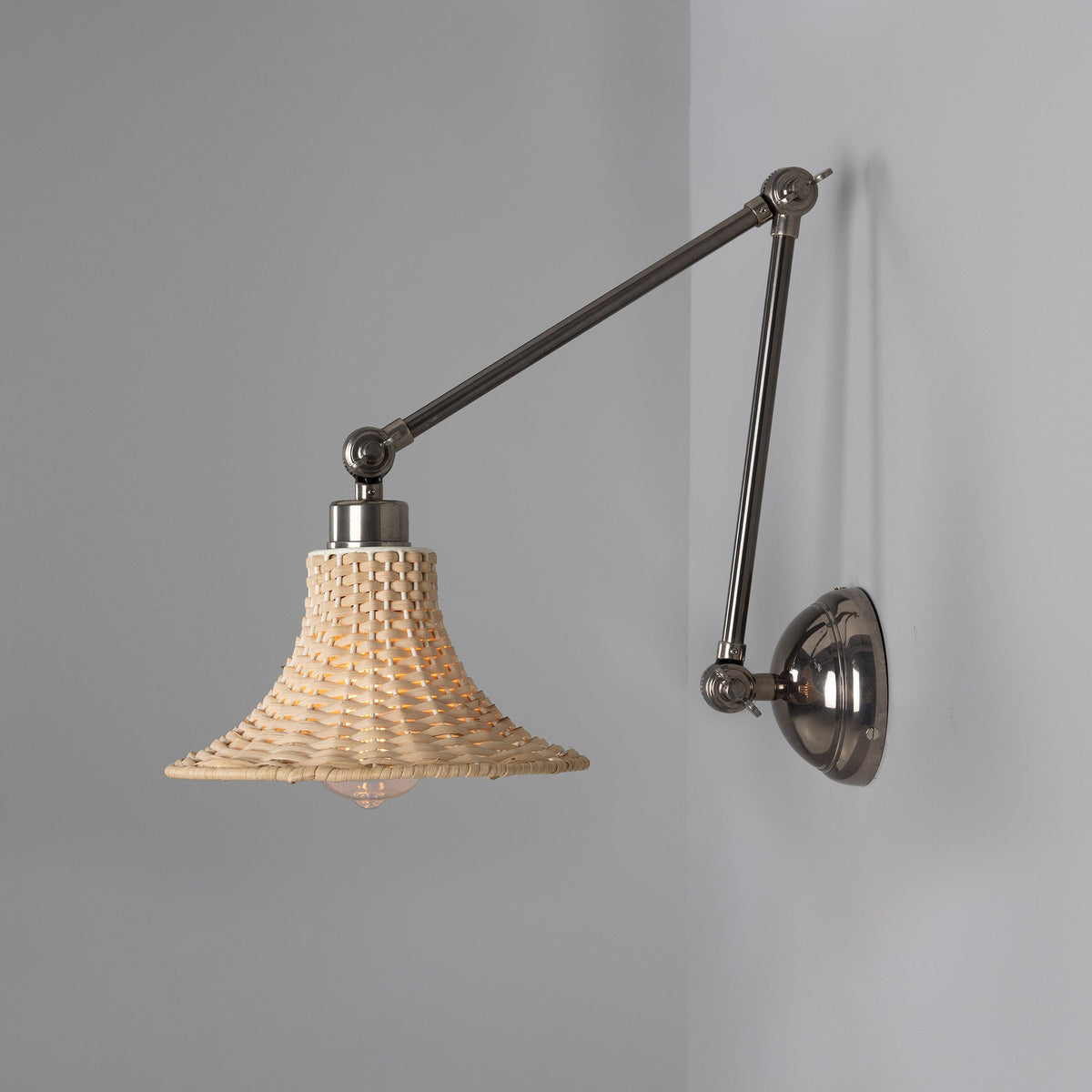 Savannah Adjustable Arm Wall Light in Antique Silver with Small Bell Shaped Rattan Shade
