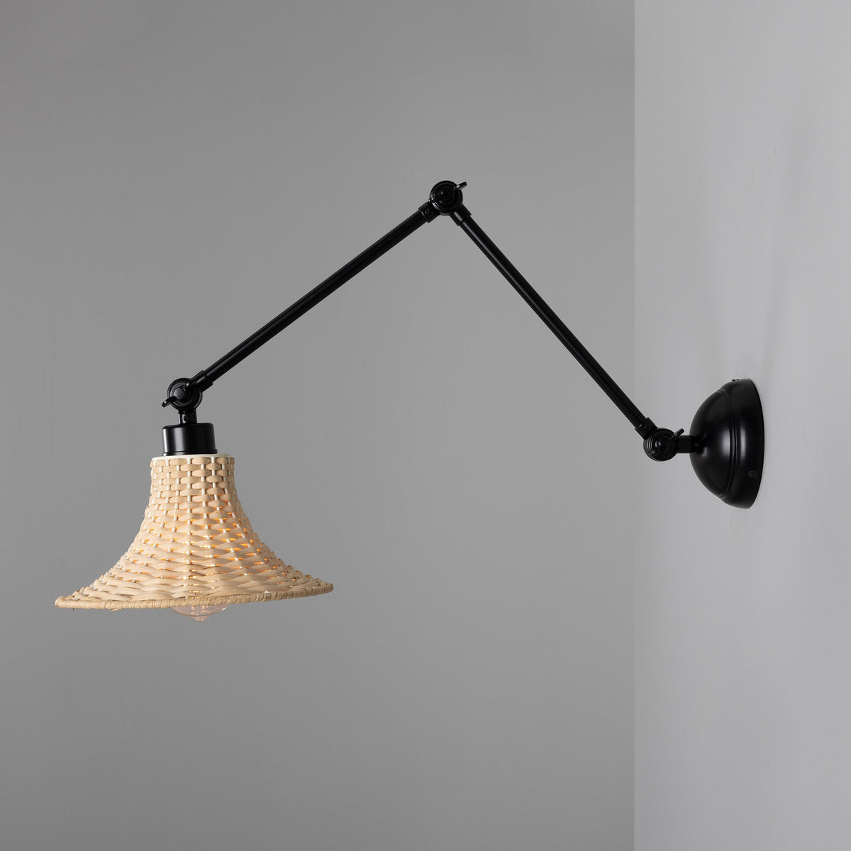 Savannah Adjustable Arm Wall Light in Matte Black with Small Bell Shaped Rattan Shade