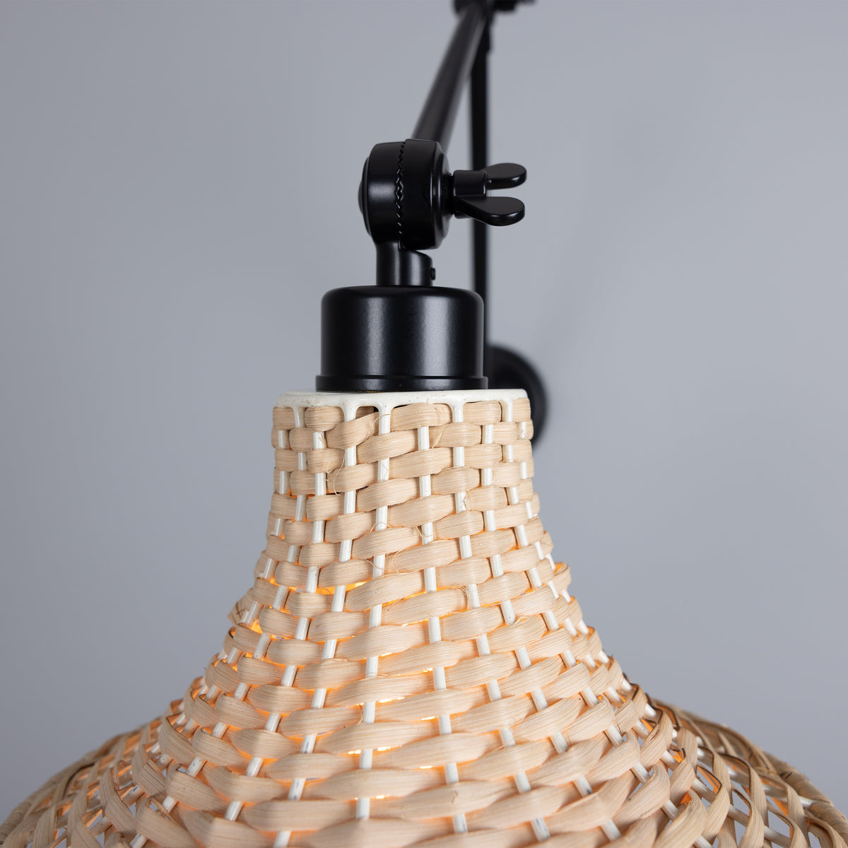 Savannah Adjustable Arm Wall Light in Matte Black with Small Bell Shaped Rattan Shade