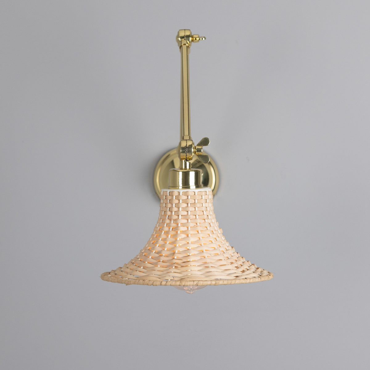 Savannah Adjustable Arm Wall Light in Polished Brass with Small Bell Shaped Rattan Shade