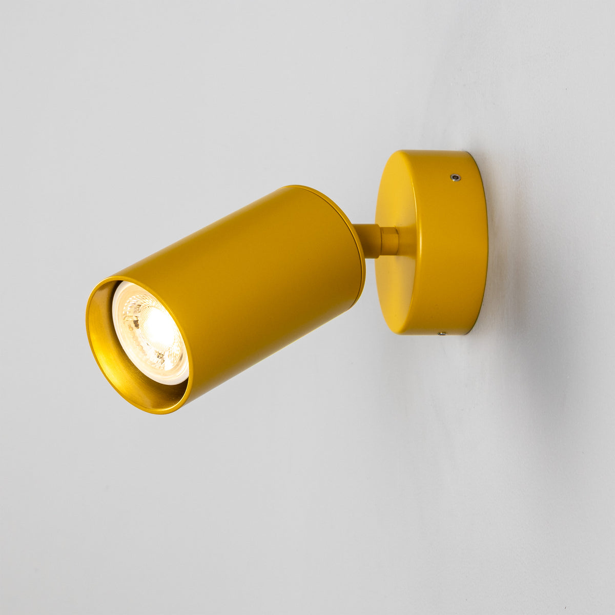 Evanston Directional Brass Wall Spotlight in Mustard Honey Yellow