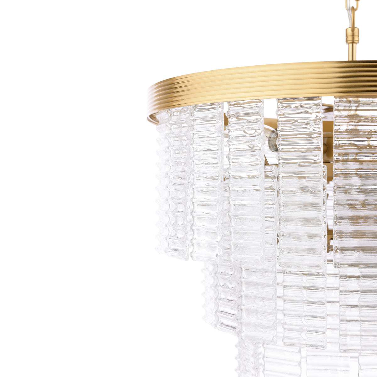 Close up of a gold chandelier with textured glass panels