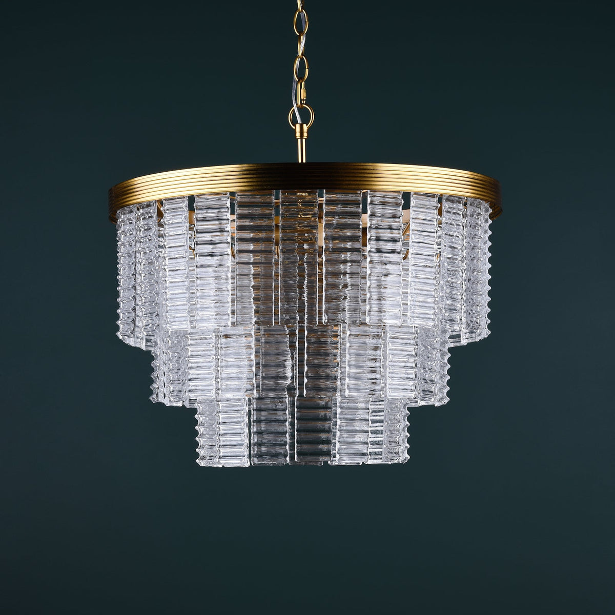 Tiered glass rod chandelier with a gold frame and chain