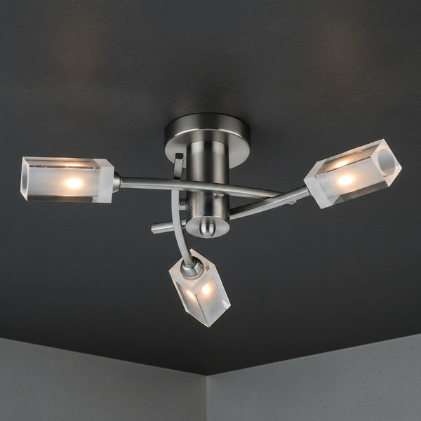 Brushed nickel ceiling light with three frosted glass cube shades.