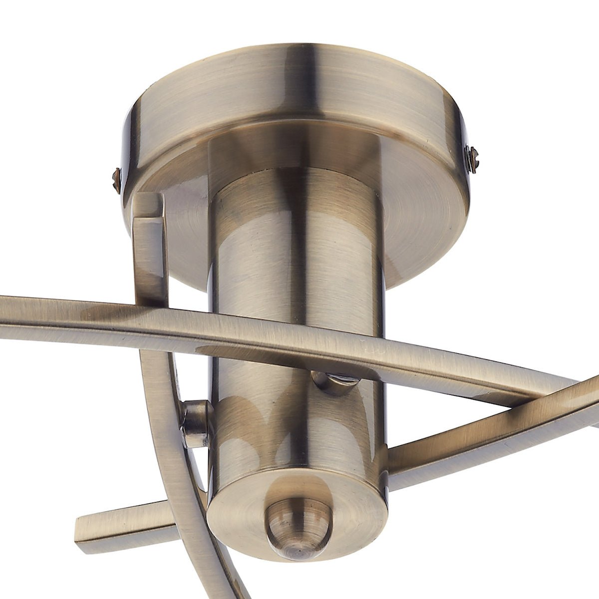 Close-up of a brass ceiling light fixture with intersecting arms.