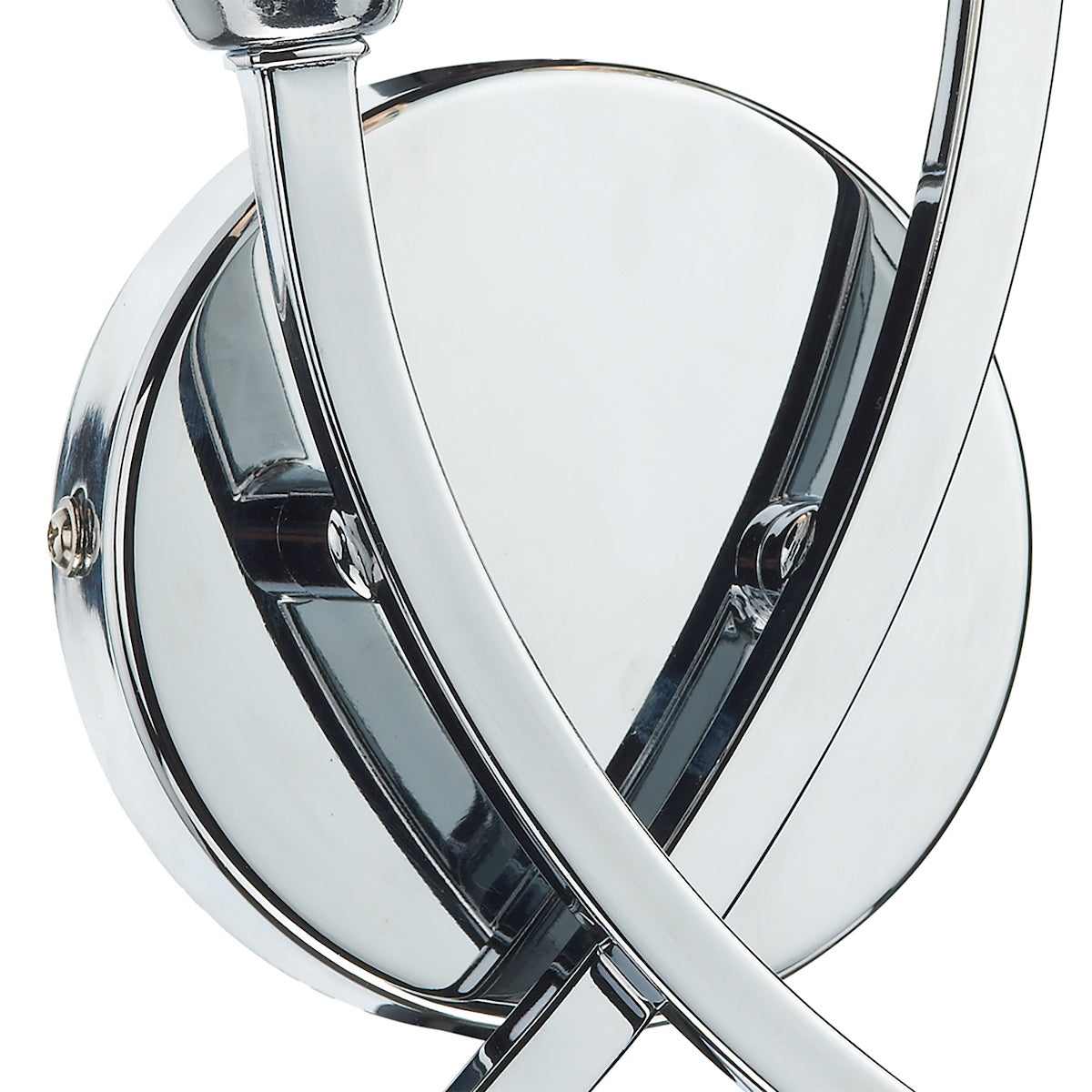 Close-up of a chrome-plated wall sconce with a circular base and curved arms.