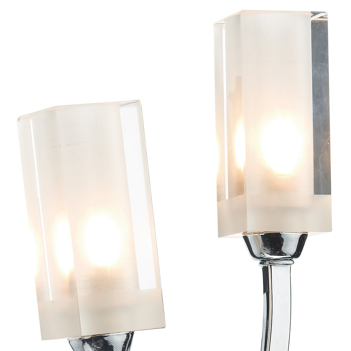 Two illuminated, rectangular, frosted glass light shades on chrome bases.