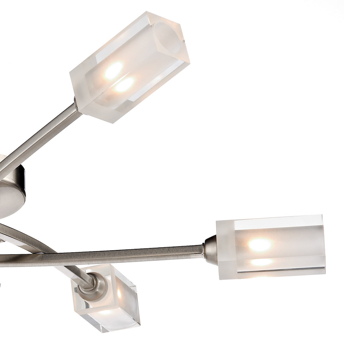 Close-up of a modern light fixture with three illuminated rectangular frosted glass shades.