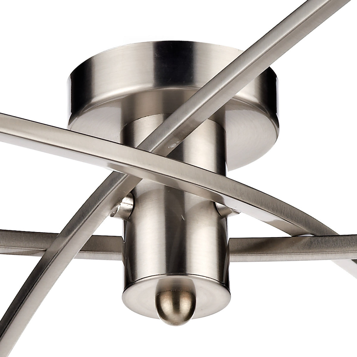Close-up of a brushed nickel ceiling light fixture with intersecting metal bands.