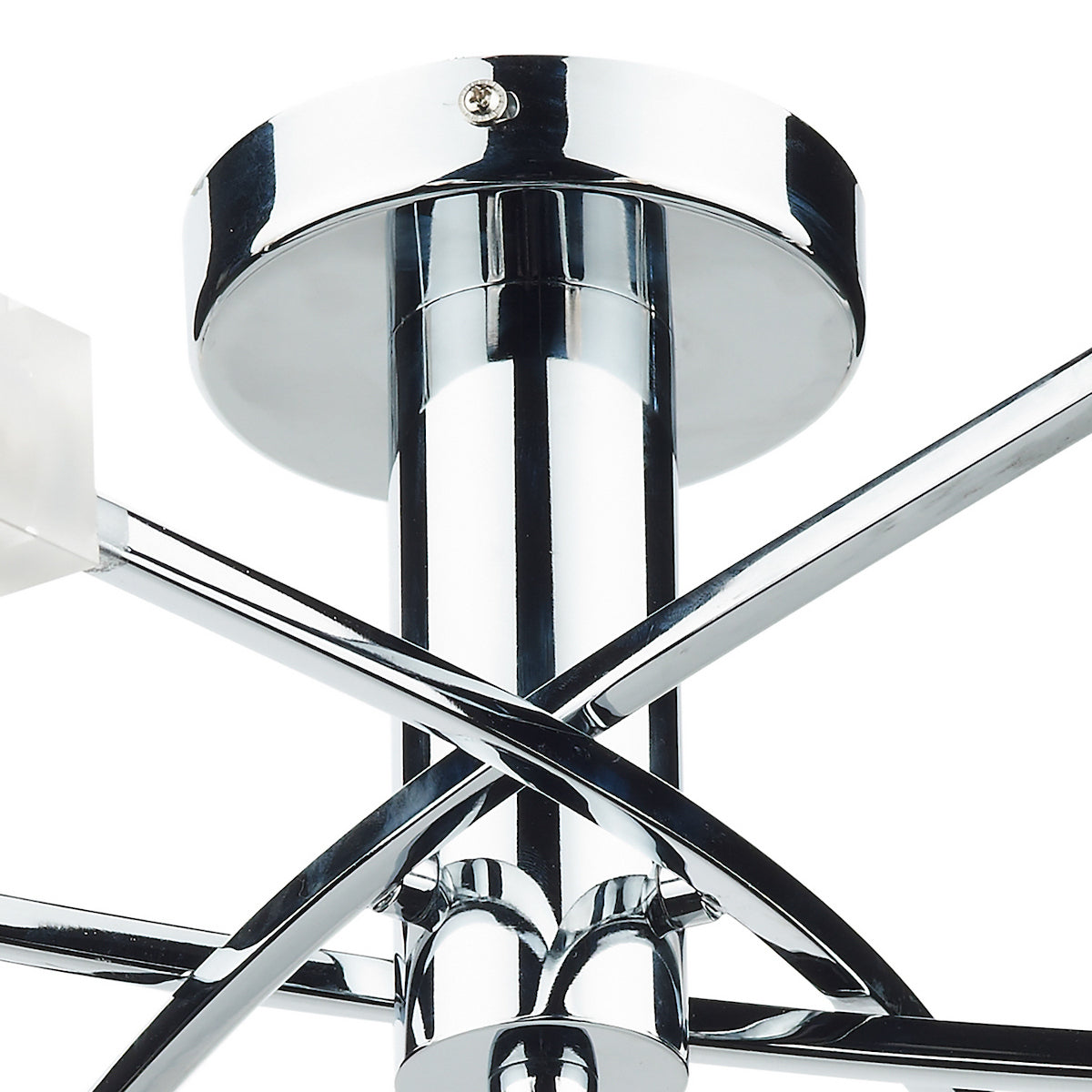 Close-up of a chrome ceiling light fixture with intersecting arms and a frosted glass shade.