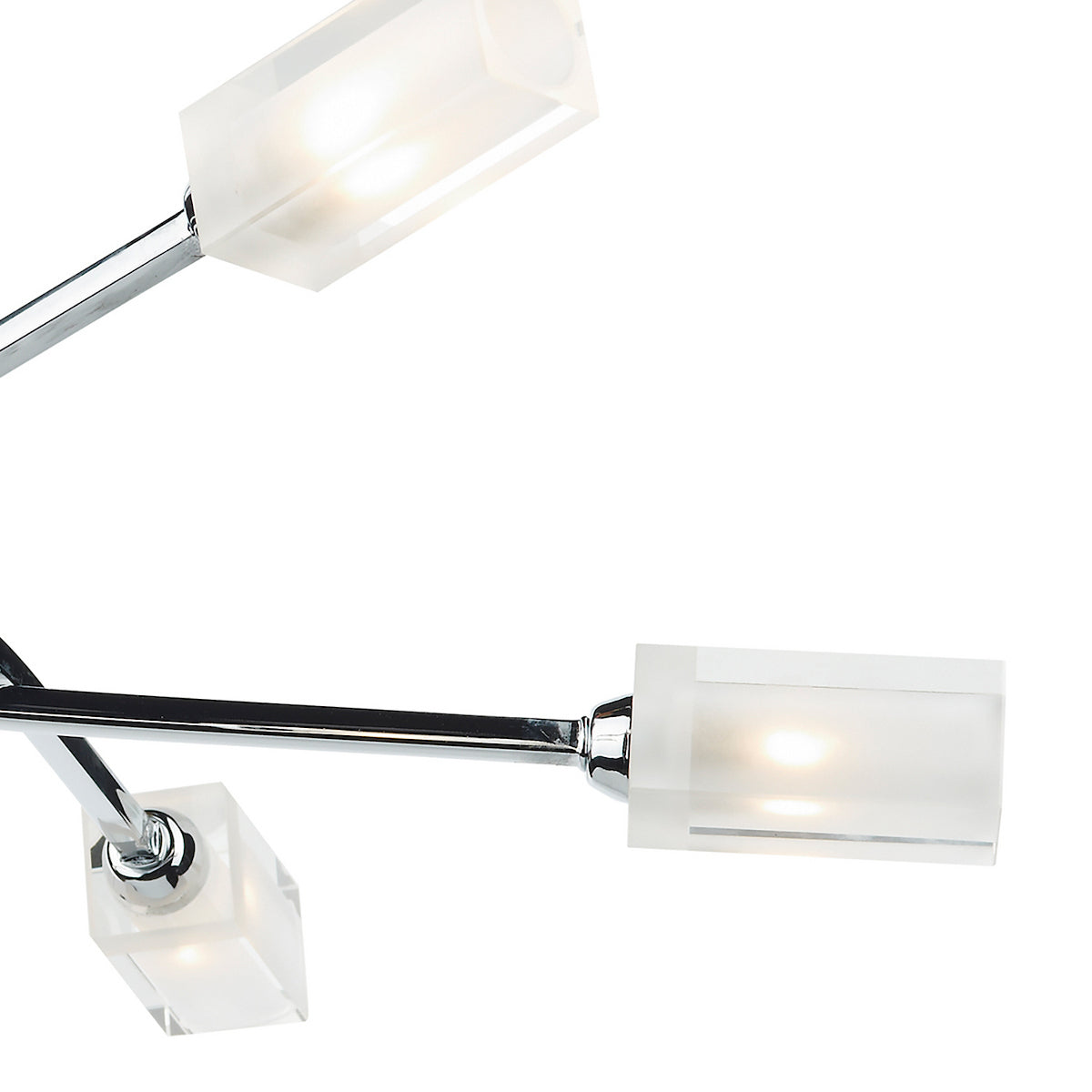 Close-up of a modern chrome light fixture with three rectangular frosted glass shades, illuminated against white.