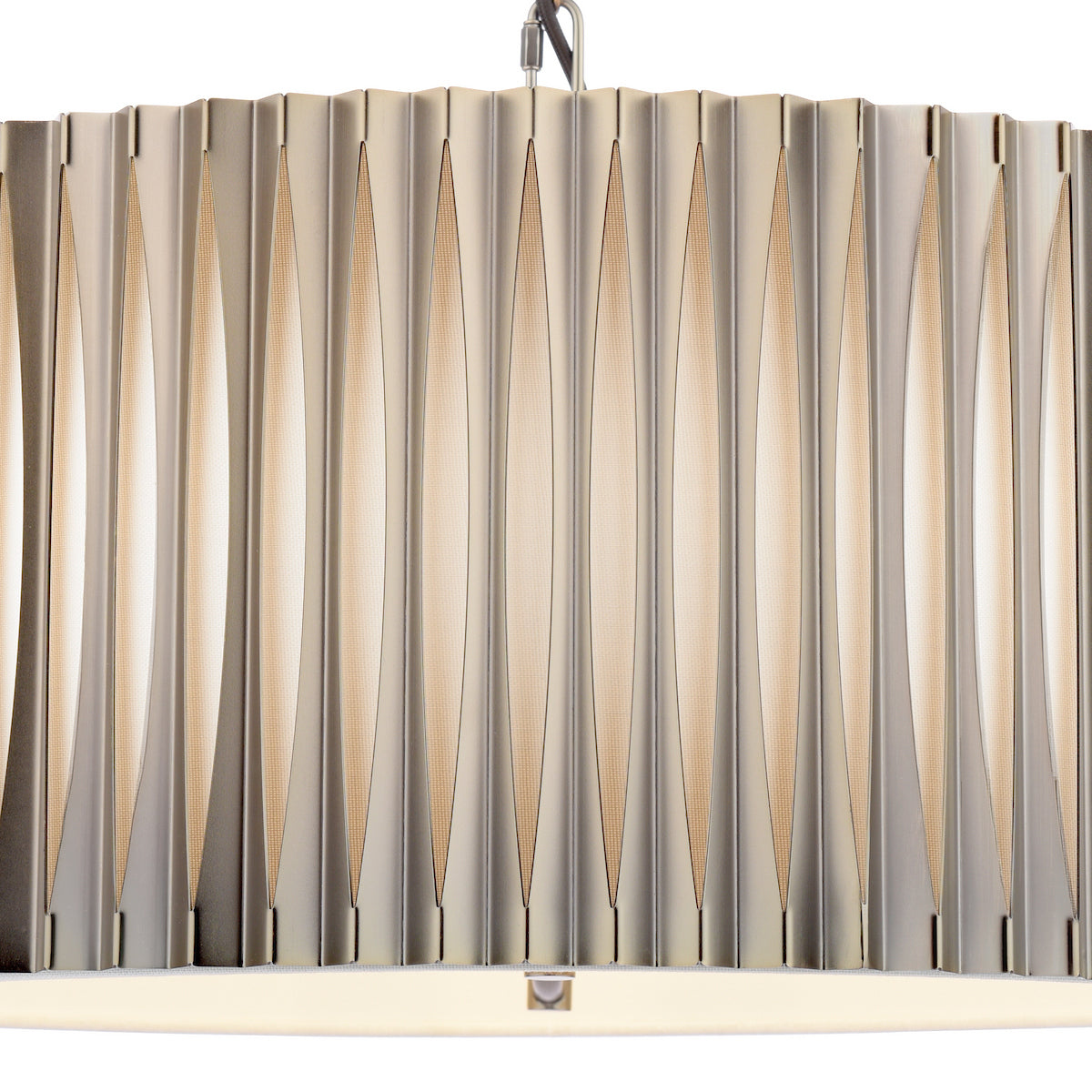 Close up of a pleated metal pendant light with vertical cutouts revealing an inner fabric shade