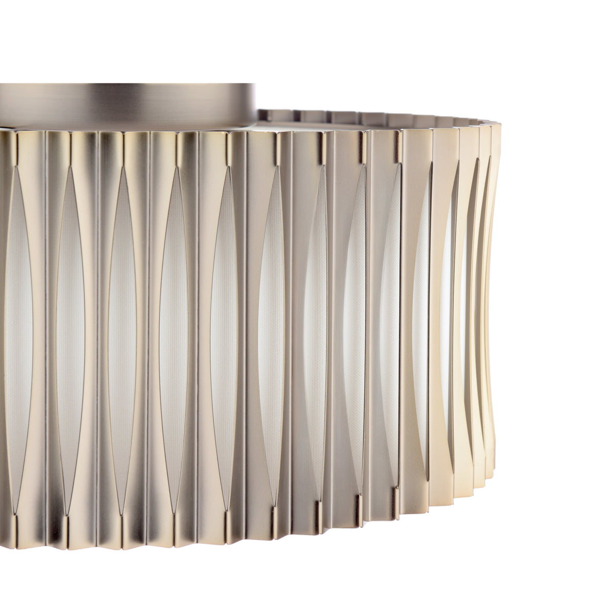 Close up of a cylindrical light fixture with vertical metal fins and a textured inner surface