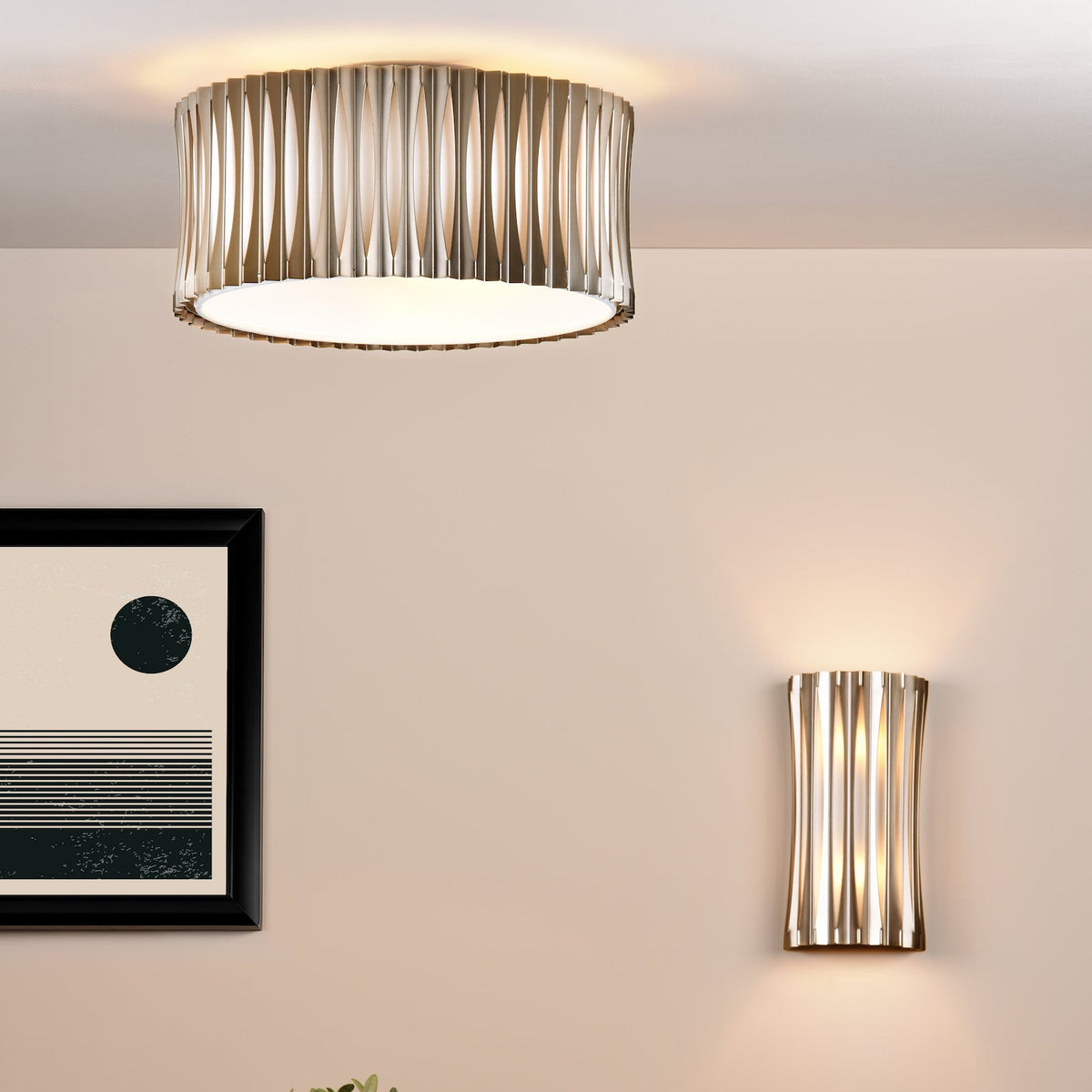 Ceiling light and wall light with a fluted design in a room with a framed picture