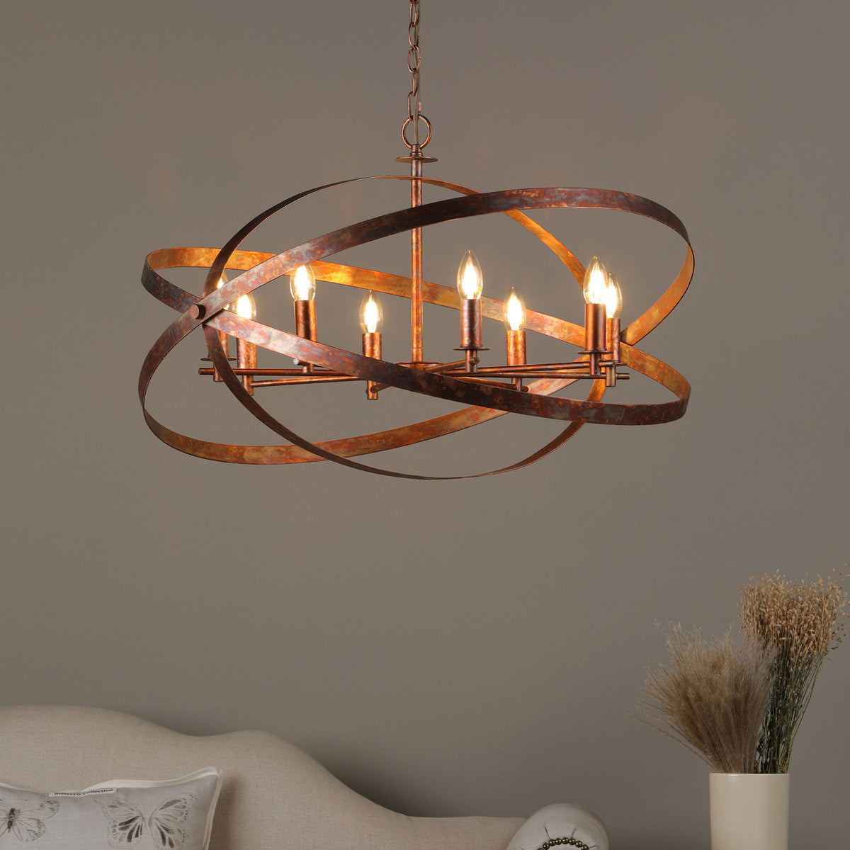 Rustic bronze chandelier with six exposed bulbs and intersecting orbital bands