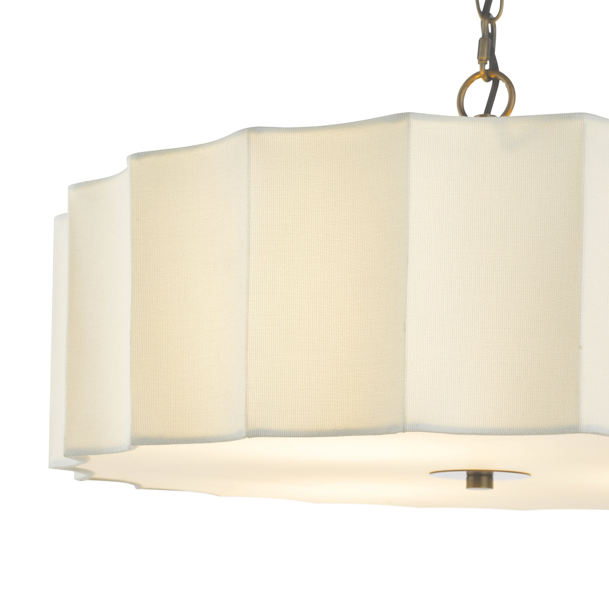 Scalloped drum chandelier with a white fabric shade and brass chain