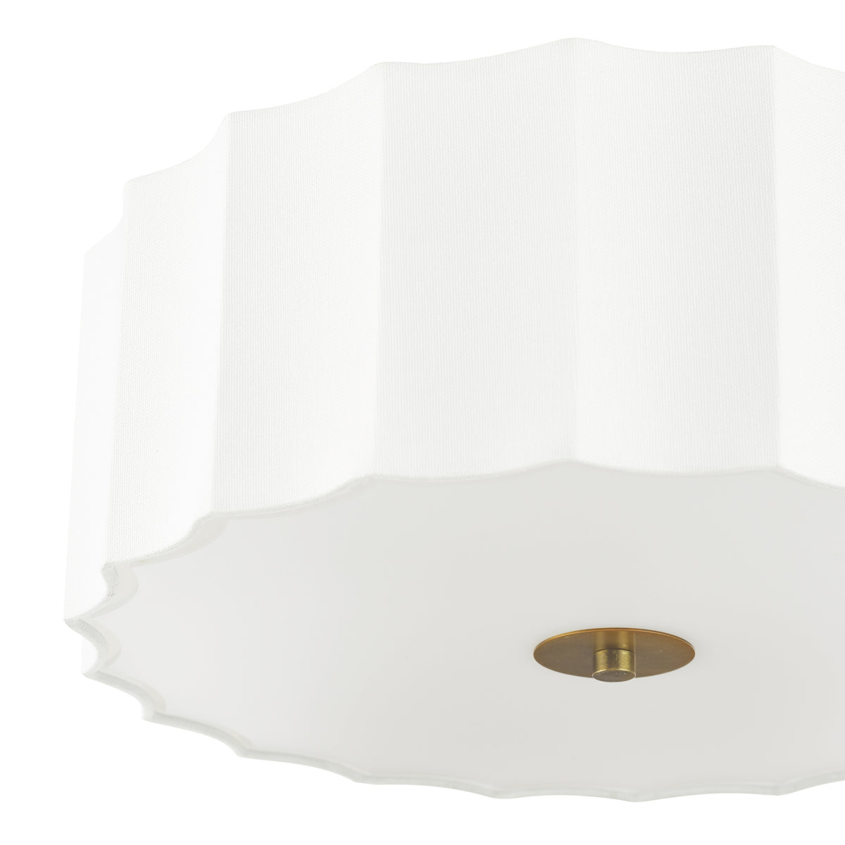 White scalloped fabric flush mount light fixture with a brass finial