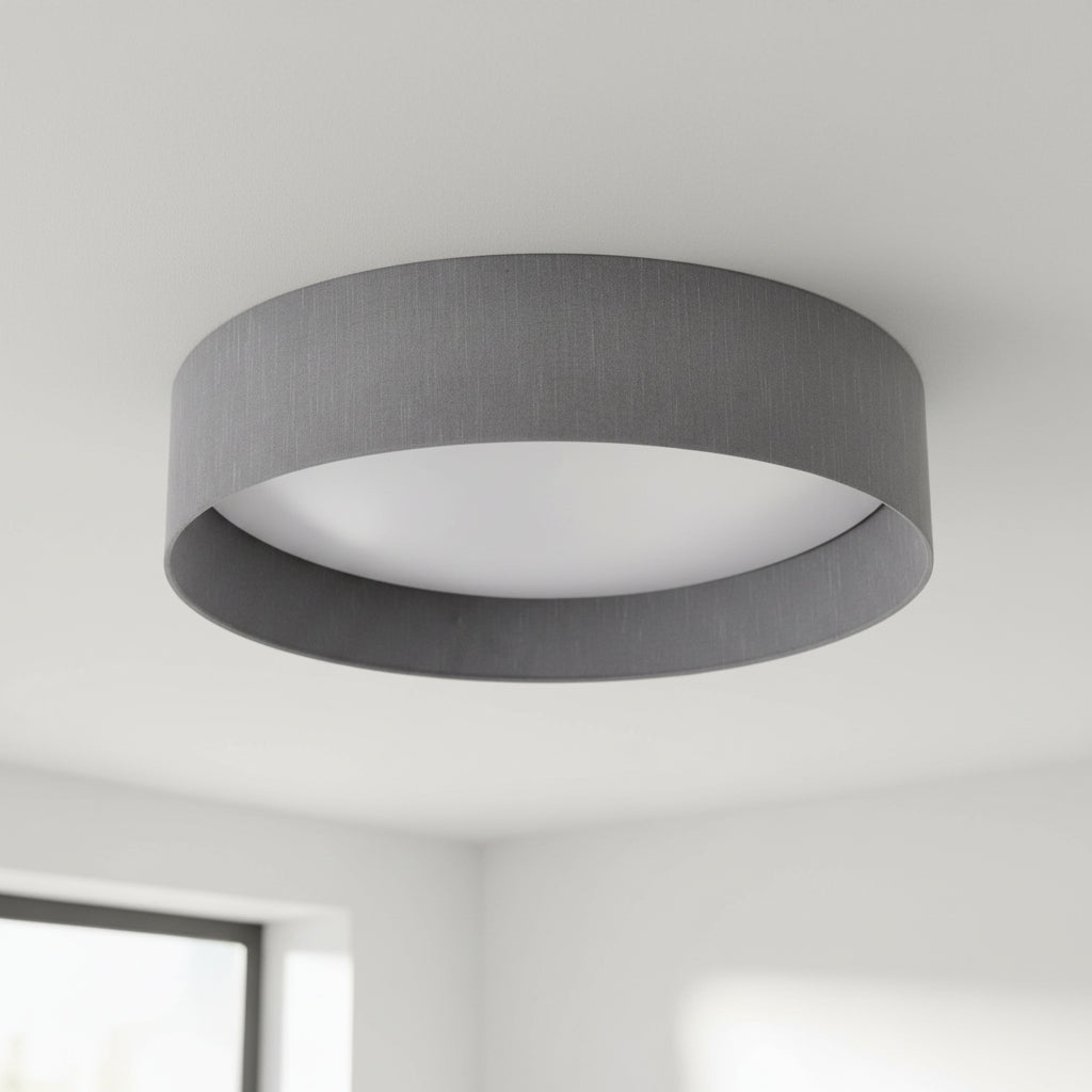 Grey fabric drum ceiling light with a white diffuser