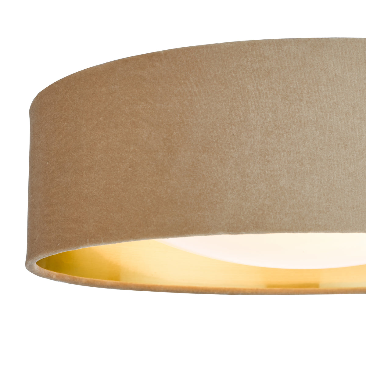 Close-up of a beige fabric lampshade with a golden interior, illuminated from within
