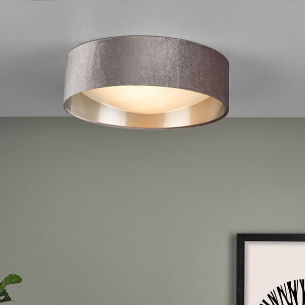 Grey velvet ceiling light with a gold interior