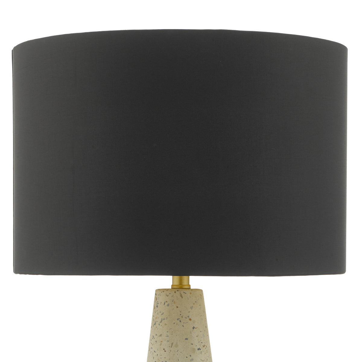 Black drum lampshade on a speckled beige base with a gold neck.