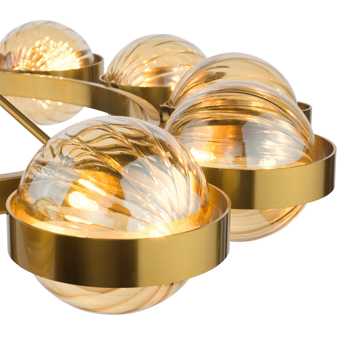 Close-up of a modern gold chandelier with multiple amber glass globe shades, each with a swirling pattern.