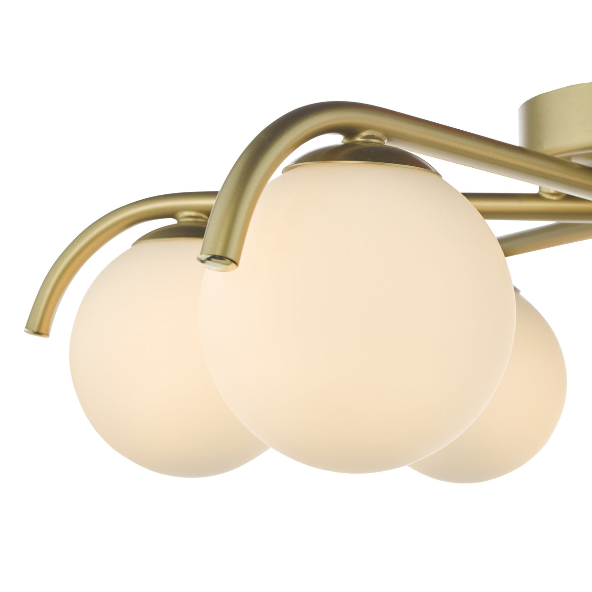 Close up of a gold chandelier with three spherical frosted glass shades