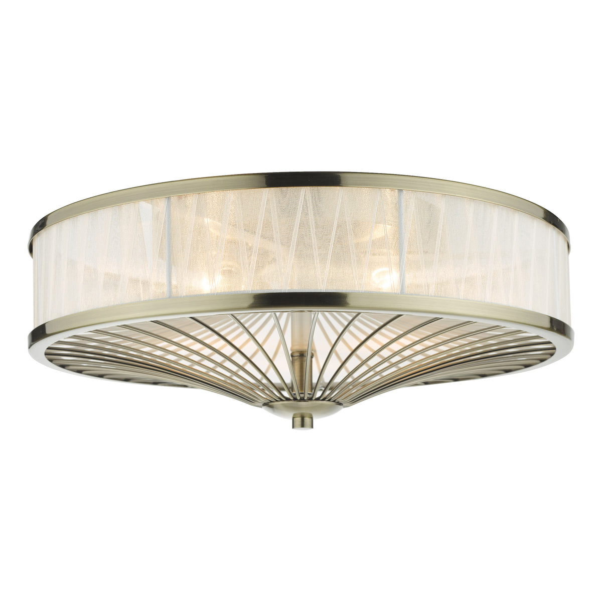 Antique brass flush mount light with a sheer fabric shade and a decorative metal cage