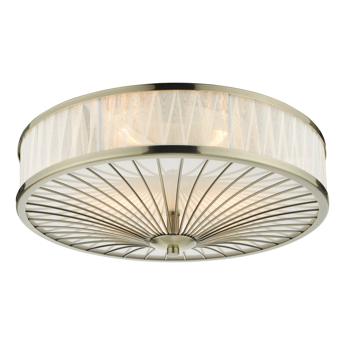 Round ceiling light with an antique brass finish, a sheer fabric shade, and a decorative metal diffuser
