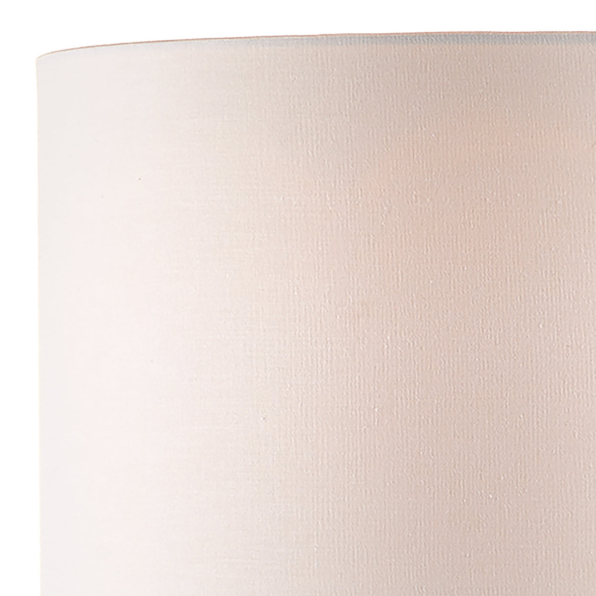 Close-up of a white fabric lampshade with a subtle texture.