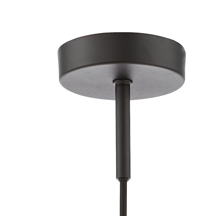Close up of a black ceiling rose with a black cable coming out of it