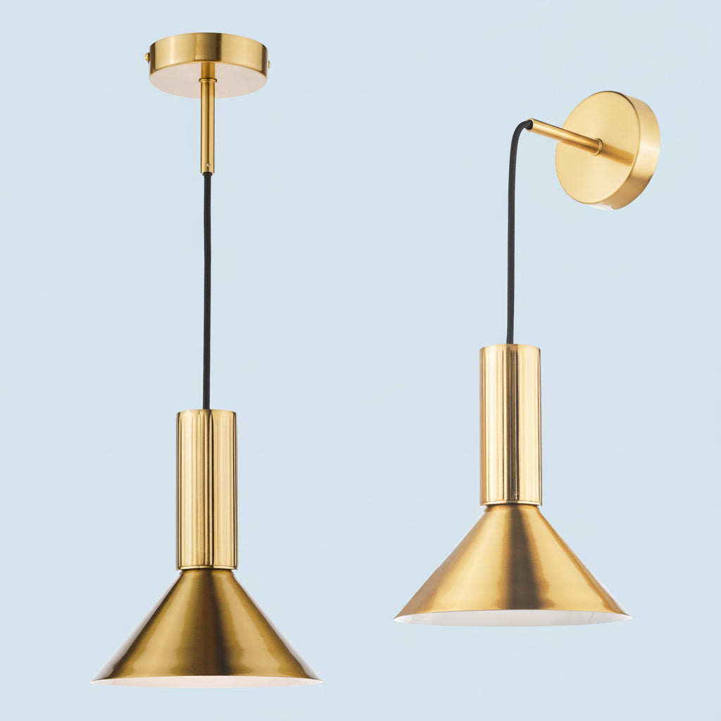 Two brass pendant lights, one hanging from the ceiling and one mounted on the wall