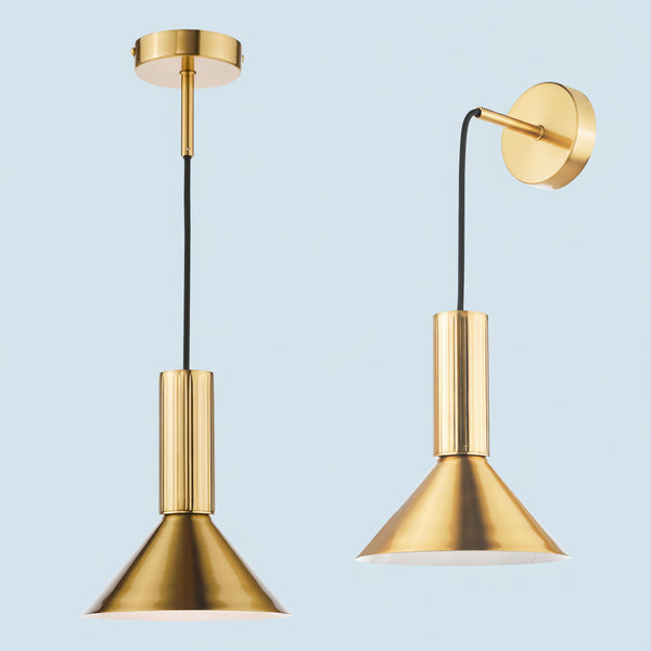 Two brass pendant lights, one hanging from the ceiling and one mounted on the wall