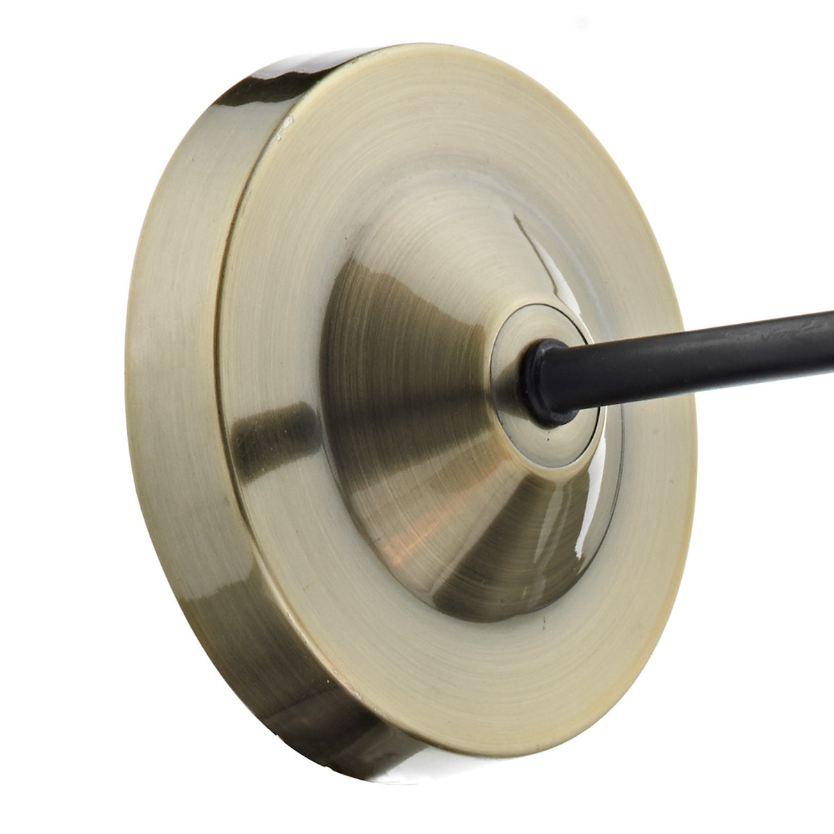 A close-up of a brass-colored metal canopy with a black rod extending from its center.