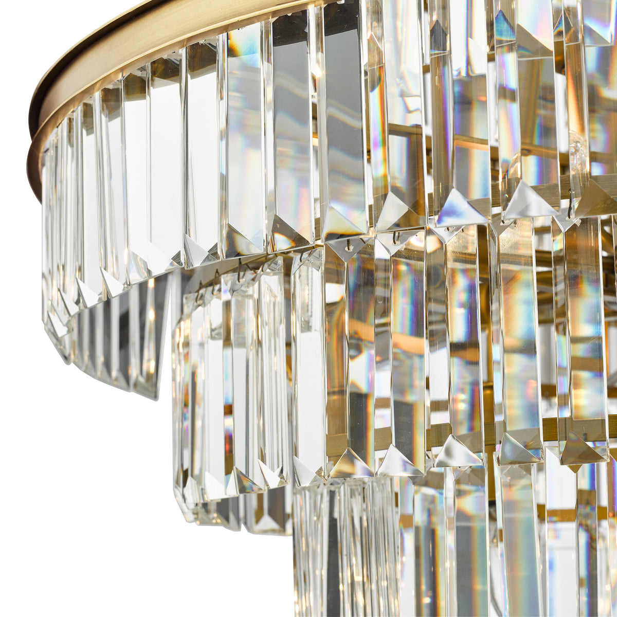 Close-up of a tiered chandelier with rectangular crystal prisms and a brass frame