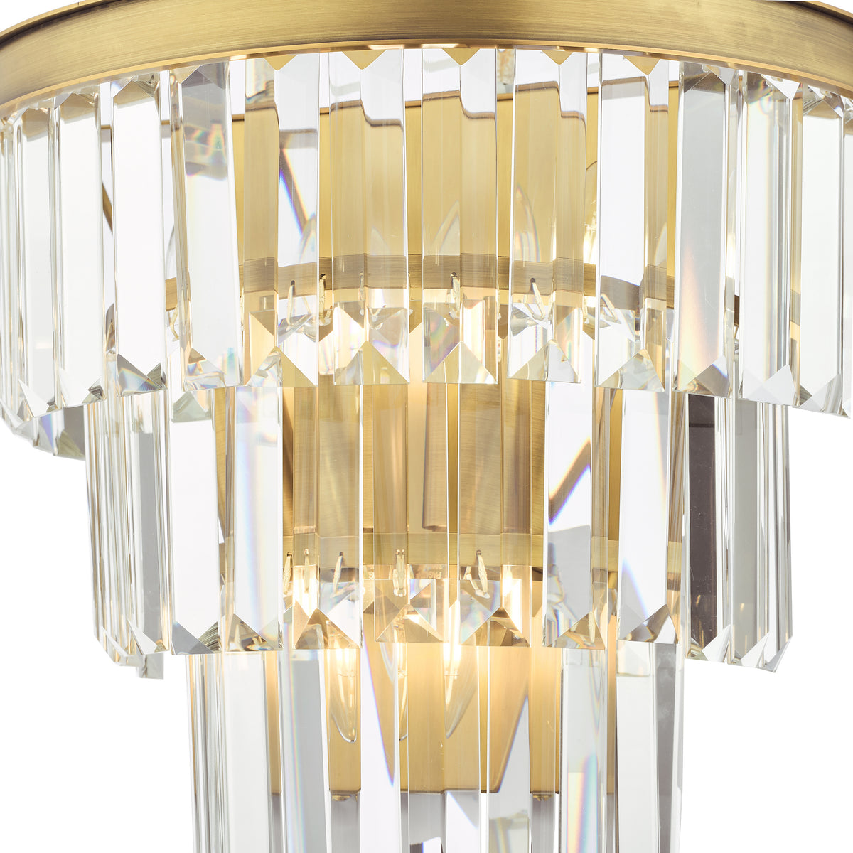 Close up of a crystal and brass wall sconce