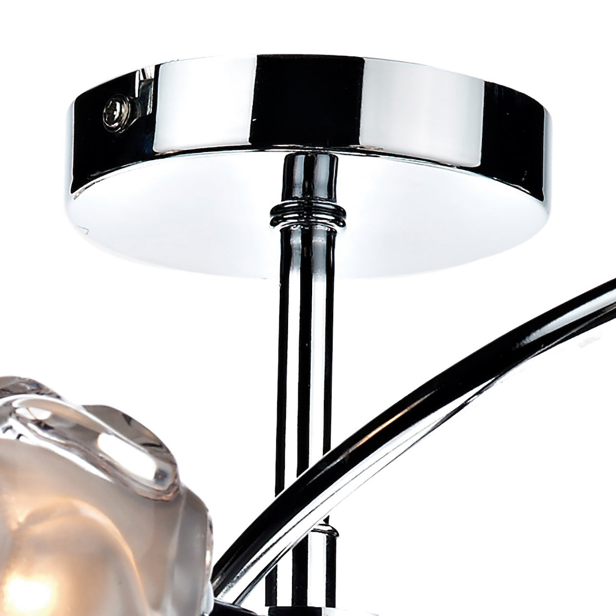 Close-up of a chrome ceiling light fixture with a frosted glass shade and exposed bulb.