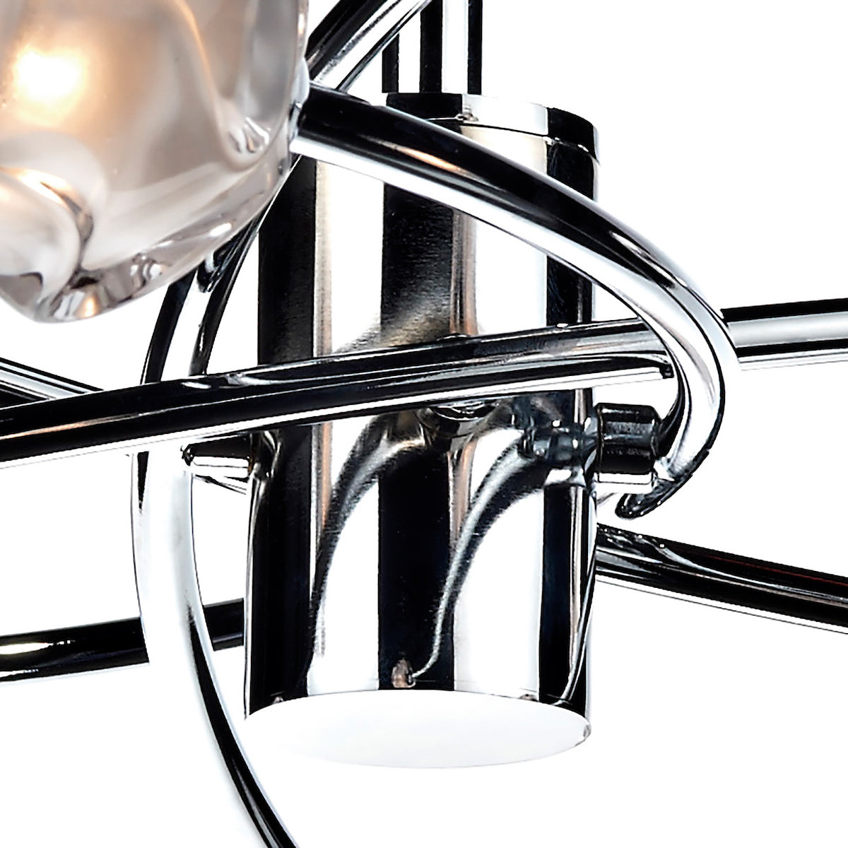 Close-up of a chrome light fixture with a glowing bulb.
