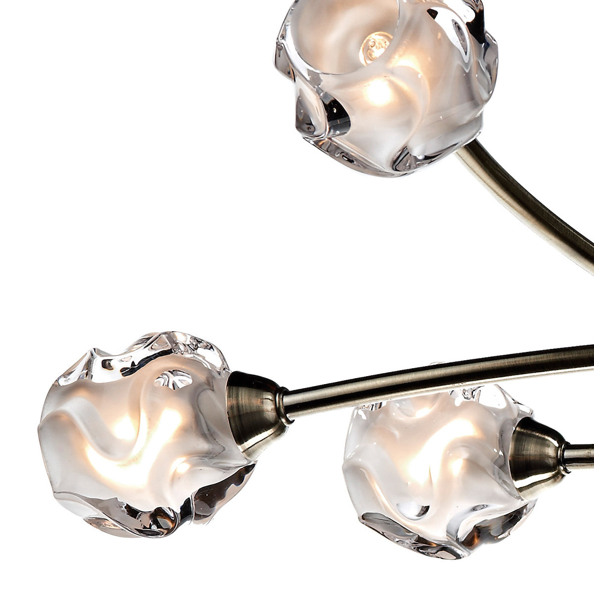 Close-up of a modern chandelier with three illuminated, textured glass shades on metal arms.