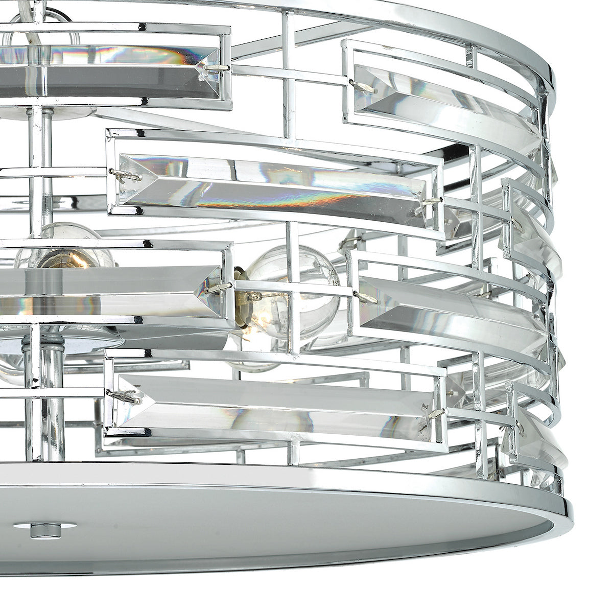 Close-up of a chrome and crystal chandelier with exposed bulbs, showing geometric design.