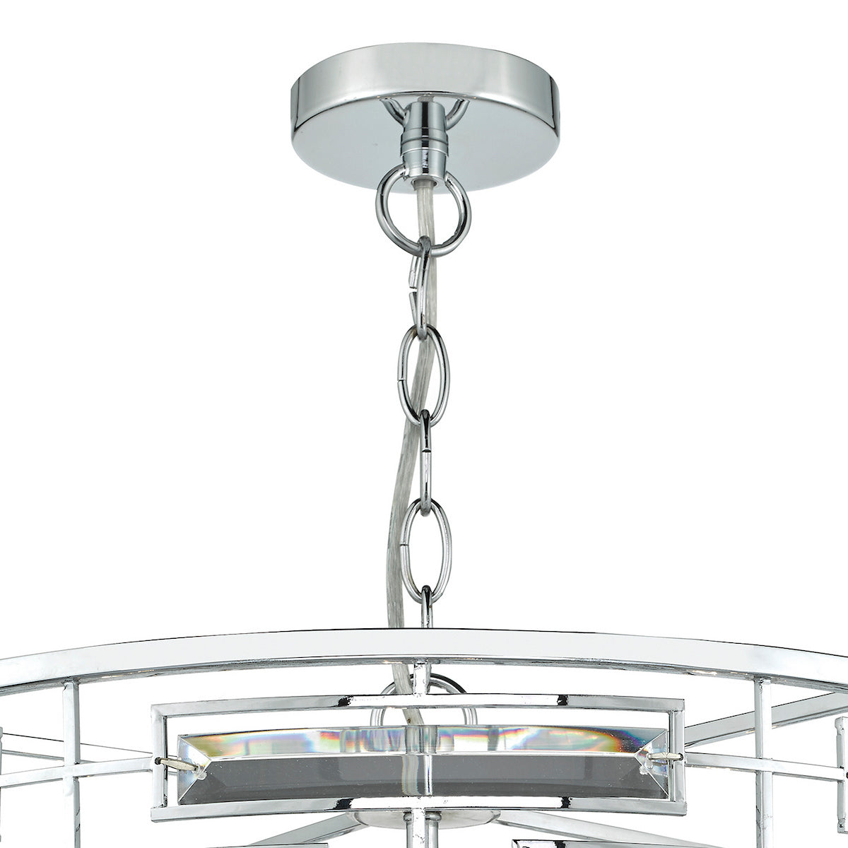 Close-up of a chrome chandelier with a chain and clear crystal accents.