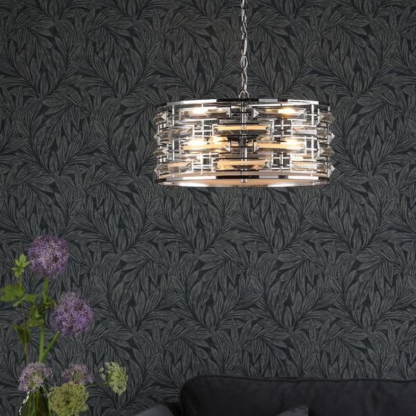 A modern chrome chandelier with rectangular crystal accents hangs from the ceiling.