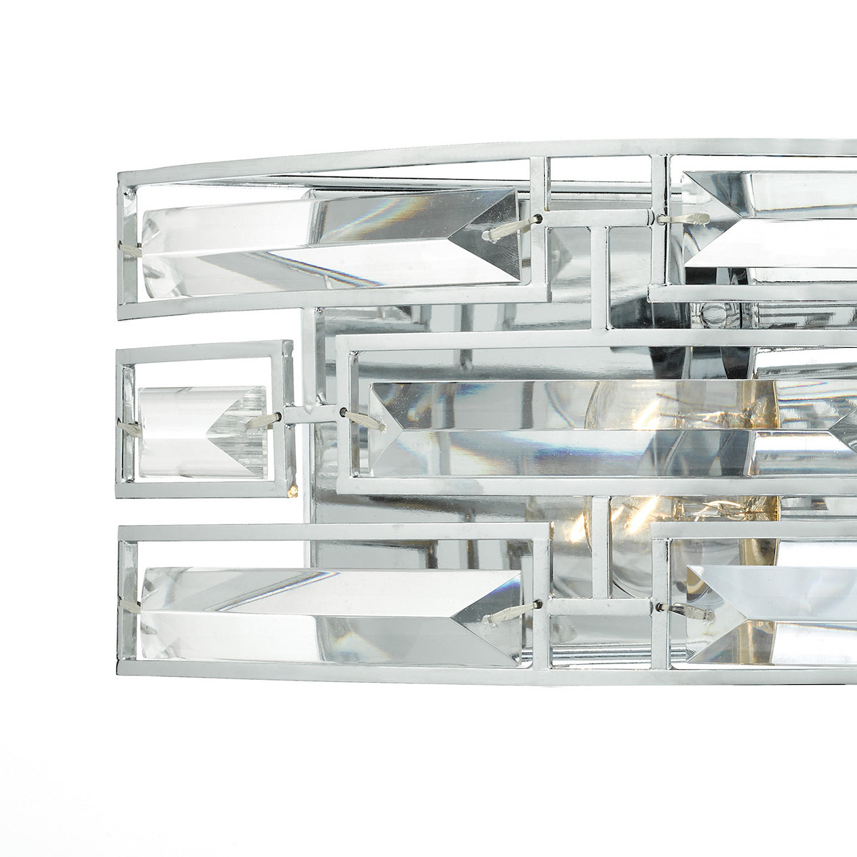 Close-up of a modern crystal and chrome light fixture with rectangular prisms.