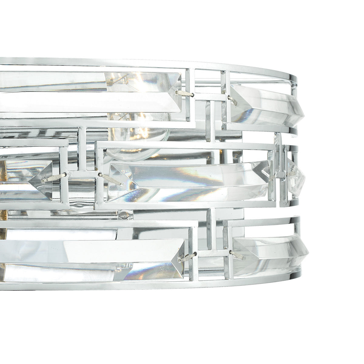 Close-up of a modern chrome light fixture with rectangular crystal accents.