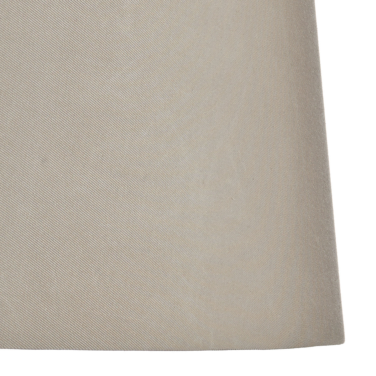 Close-up of a light beige fabric with diagonal ribbed texture.